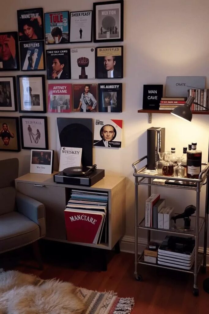 Cozy man cave with vinyl records, turntable, wall art, and a bar cart for a stylish and relaxing atmosphere.