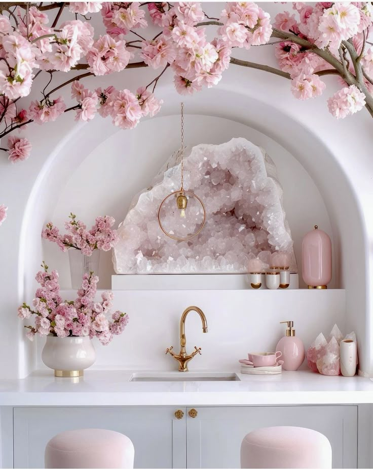 Elegant kitchen decor with pink cherry blossoms, luxurious quartz crystal, and gold accents for a chic, modern aesthetic.