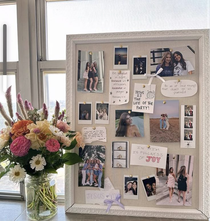 Bulletin board with photos, inspirational quotes, and a colorful flower vase by the side, set against a window background.