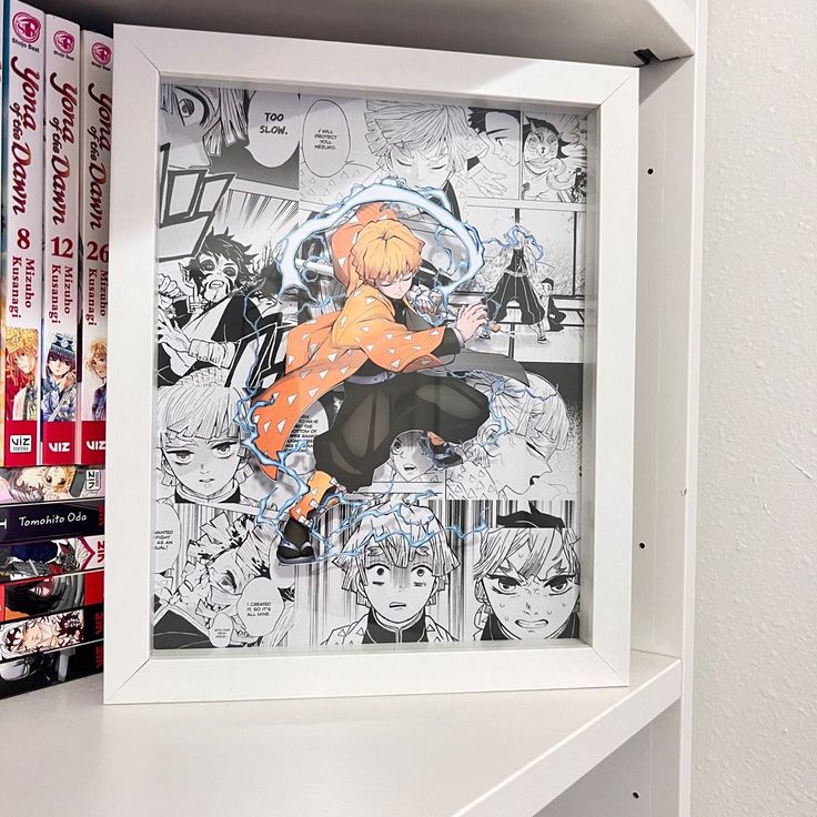 Framed manga art with dynamic character pose, surrounded by detailed comic panels; manga volumes visible on the shelf.