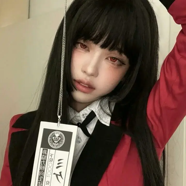 Young person with long black hair, red eyes, and a red jacket, holding a paper with Japanese text. Kawaii cosplay style.