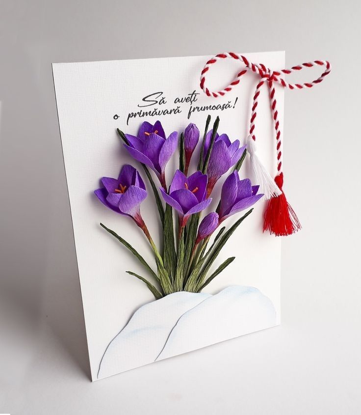 Greeting card with purple crocuses, a red-white string, and Romanian text Să aveți o primăvară frumoasă, meaning Have a beautiful spring!