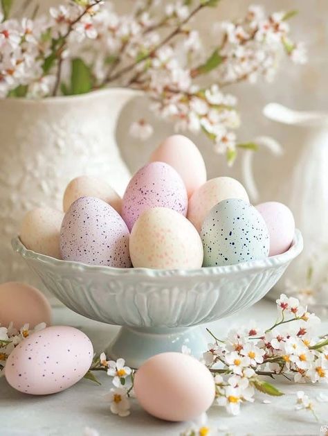 00ebe0a215fec3929f0aca076bb4619a - Handy Home Beautiful pastel Easter eggs in a decorative bowl surrounded by cherry blossoms, creating a serene spring atmosphere.