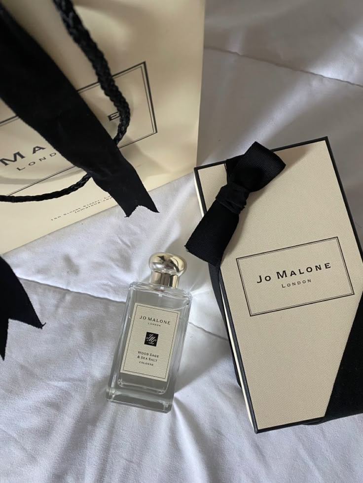 Jo Malone Wood Sage & Sea Salt cologne with elegant packaging and gift bag on white background.