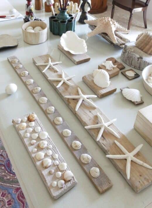 7505016c-8254-4450-90aa-1d1a19ea3a8e - Handy Home Decorative seashell and starfish arrangement on a table; beach-themed crafts and natural decor display.
