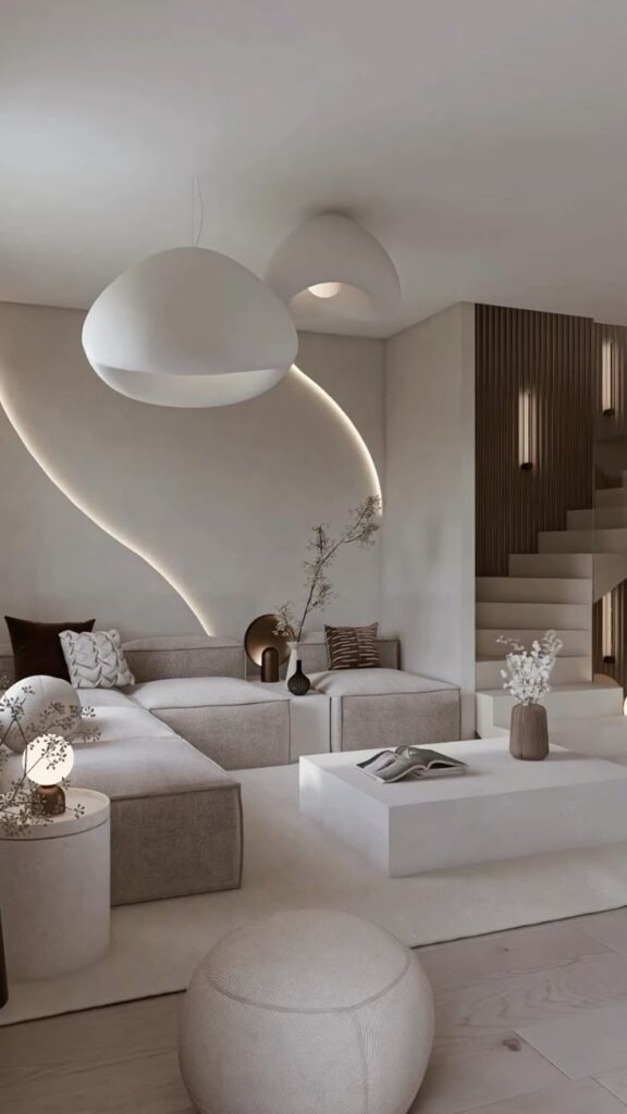 Modern minimalist living room with neutral tones, elegant lighting, and contemporary furniture for a stylish, cozy ambience.