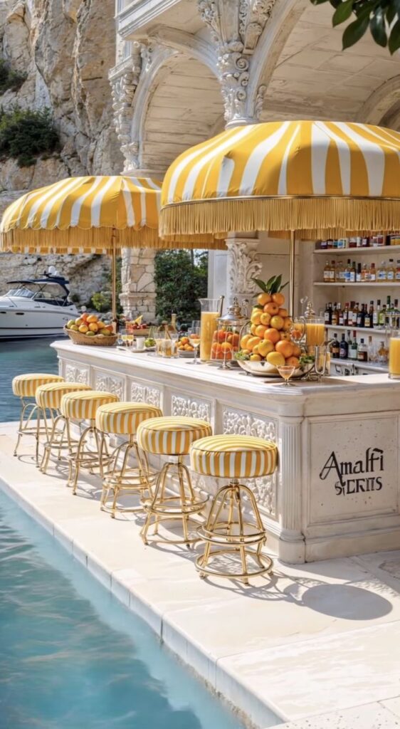 Luxurious poolside bar with yellow striped umbrellas and stools beside turquoise water, offering fresh fruit and drinks. Ideal summer escape.
