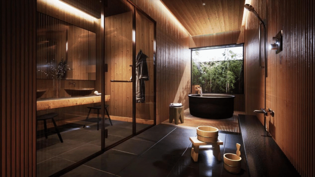 image - Handy Home Modern wooden bathroom featuring glass shower, black tub, and garden view, creating a serene spa-like atmosphere.