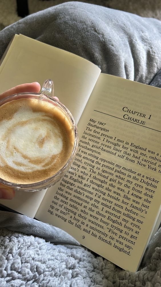 Cozy morning with a cup of coffee and an open book, perfect for relaxation and peaceful reading time.
