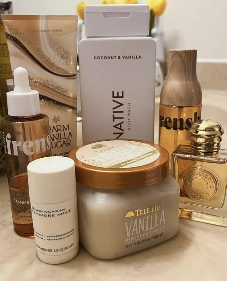 7eccbc1c-312e-4d52-aa36-cbe32f3edc5c - Handy Home Vanilla-scented body care products, including body wash, scrub, and lotion, on a bathroom counter.