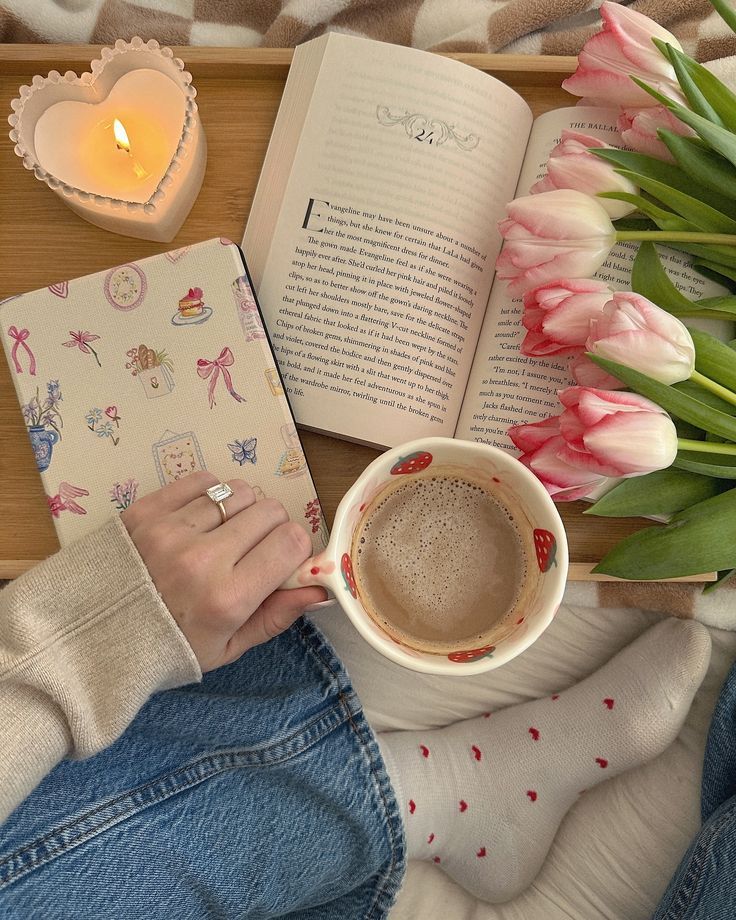 4e033b6c-51c0-497e-a6a6-71f0ca429a0d - Handy Home Cozy reading scene with coffee, open book, heart candle, and tulips on a tray, perfect for a relaxing day indoors.