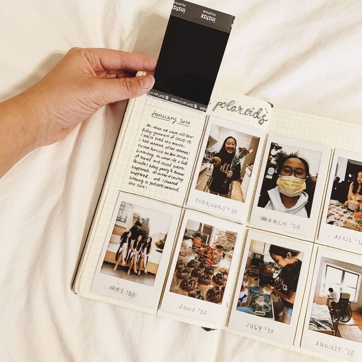 Person holding a scrapbook with Polaroid photos labeled by months from early to mid-2020, capturing various moments during the COVID-19 pandemic.
