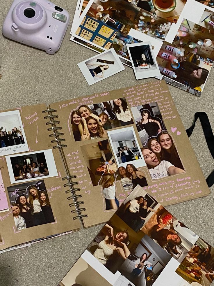 Scrapbook with photos and captions of friends having fun, surrounded by a camera and printed images on a carpeted floor.