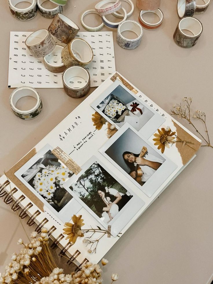 Scrapbook with Polaroid photos, floral decor, and washi tape. Artful design with dried flowers and styled arrangements.