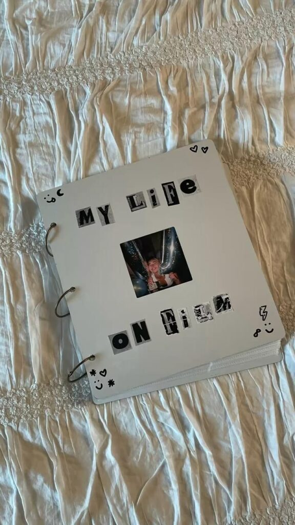 Scrapbook titled My Life On Film with a photo on a white quilted background.