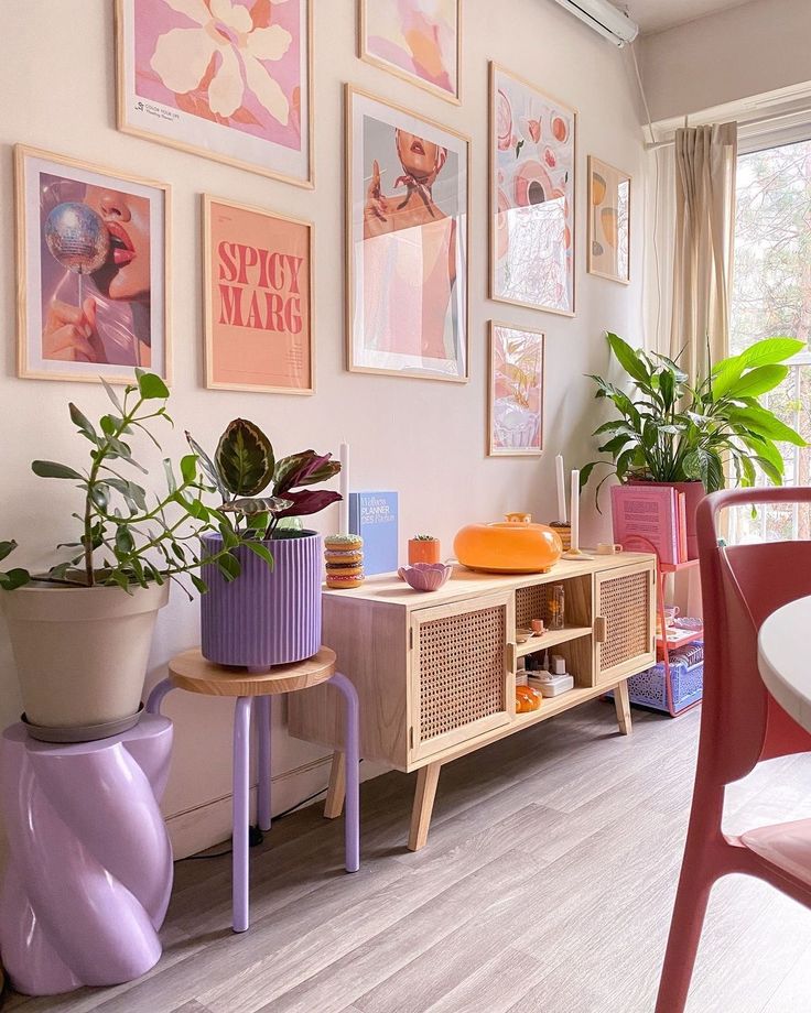 Modern living room corner with abstract wall art, vibrant plants, and stylish decor in pastel hues. Cozy and artistic interior design.