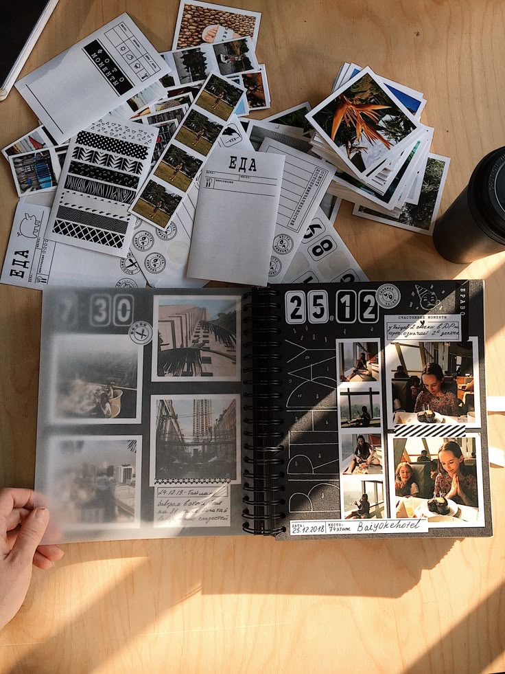 Scrapbook on a table with photos and decorative elements showcasing memories and travel adventures.