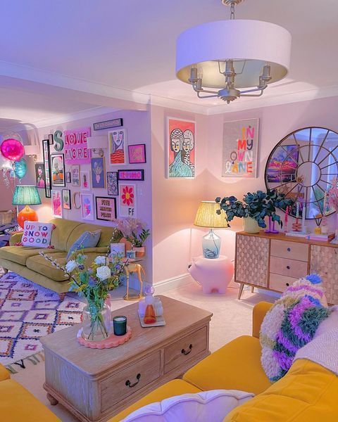 Vibrant living room with colorful wall art, yellow sofas, and eclectic decor in a cozy setting. Cozy modern interior design.