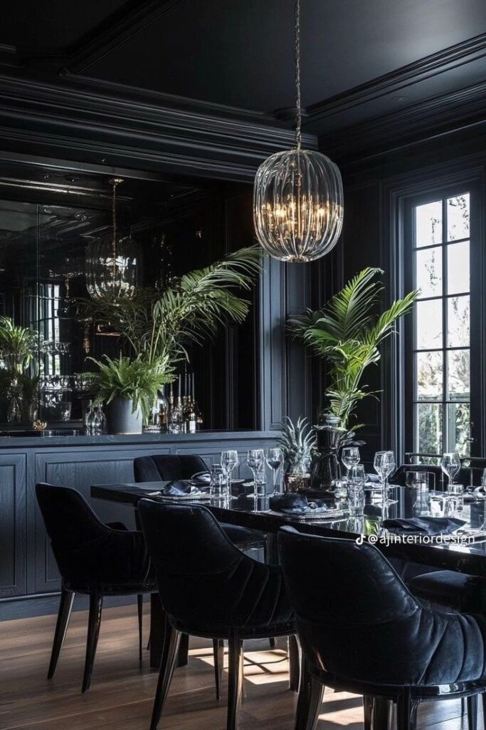 Elegant dining room with dark decor, lush plants, and a modern chandelier. Sleek, sophisticated ambiance perfect for luxury dining.