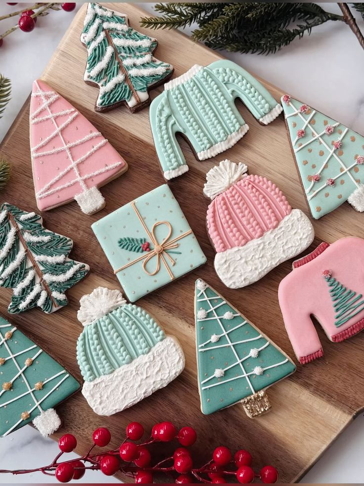 Festive Christmas cookies shaped like trees, sweaters, hats, and gifts on a wooden board. Perfect for holiday celebrations.