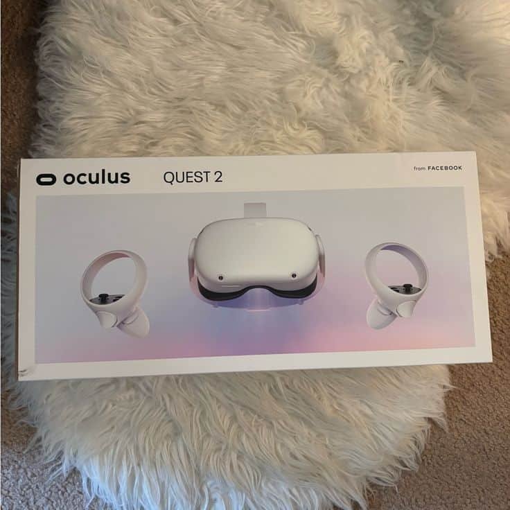 Oculus Quest 2 VR headset box with controllers on a soft beige surface. Perfect for immersive virtual experiences.