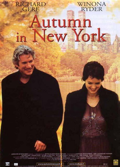 Movie poster for Autumn in New York featuring a man and woman walking with fall foliage and cityscape in the background.