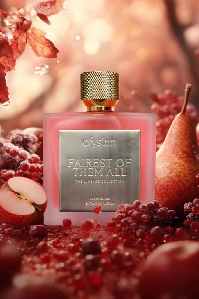 Elegant perfume bottle in autumn setting with fruits and leaves; Fairest of Them All fragrance by Elysian.