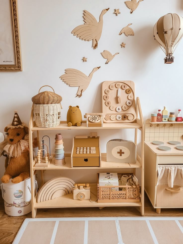 Wooden kids' playroom with toys, nursery decor, and wall art featuring flying birds. Cozy, organized, and creative space.
