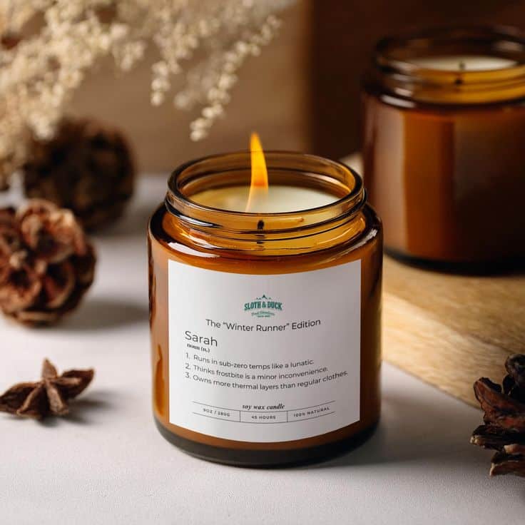 Cozy amber candle labeled “Winter Runner Edition” in a calming setting with seasonal decor, perfect for a warm, inviting ambiance.