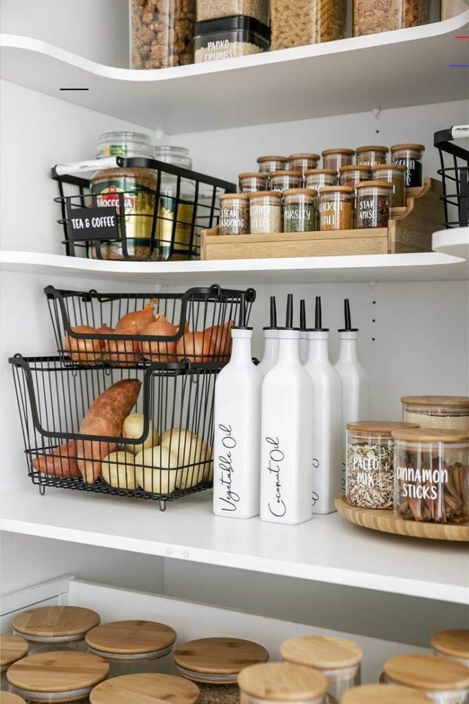 Organized pantry shelves with bottles, spices, onions, potatoes, and labeled jars. Perfect kitchen storage solutions for easy access.