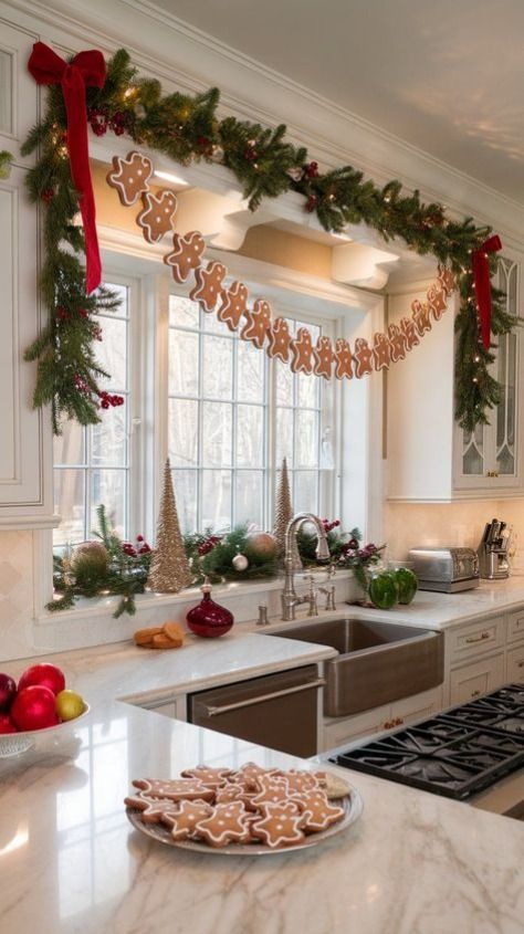 50 Best DIY Christmas Kitchen Decor Ideas - Handy Home Festive kitchen with gingerbread garland, holiday greenery, and cookies on the counter. Cozy Christmas decor and cheerful ambiance.