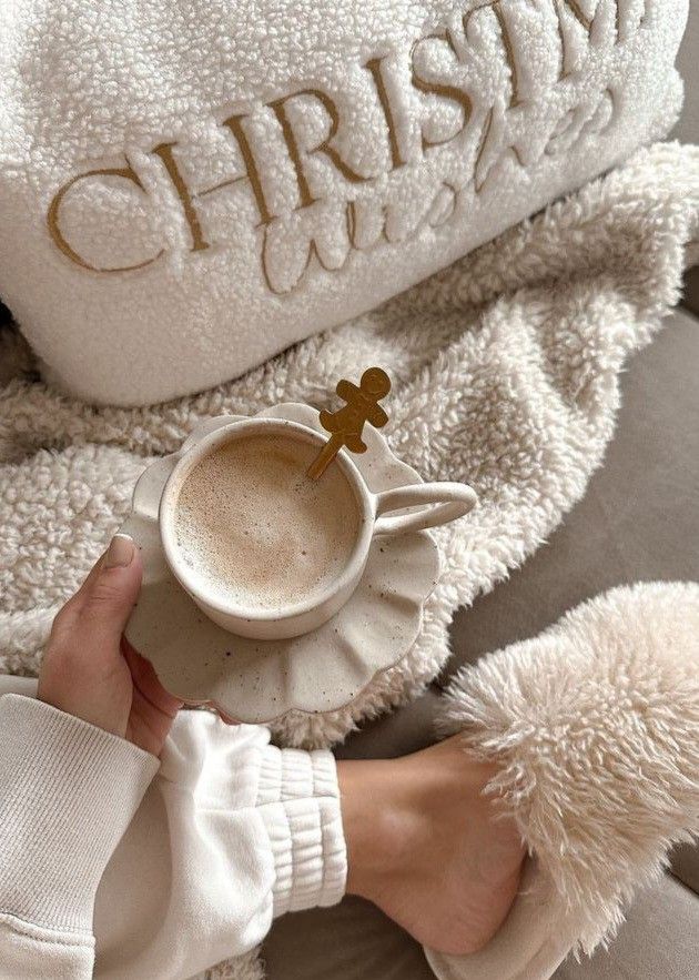 93dafd9d-6543-4fe4-806a-f7bdaeac25a3 - Handy Home Cozy winter vibes with a cup of coffee, fluffy slippers, and a Christmas wishes pillow, perfect for a relaxing holiday morning.