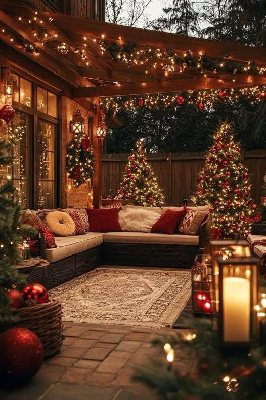 Everything Christmas - Handy Home Cozy outdoor patio decked with festive lights, Christmas trees, and comfortable seating for a warm holiday ambiance.