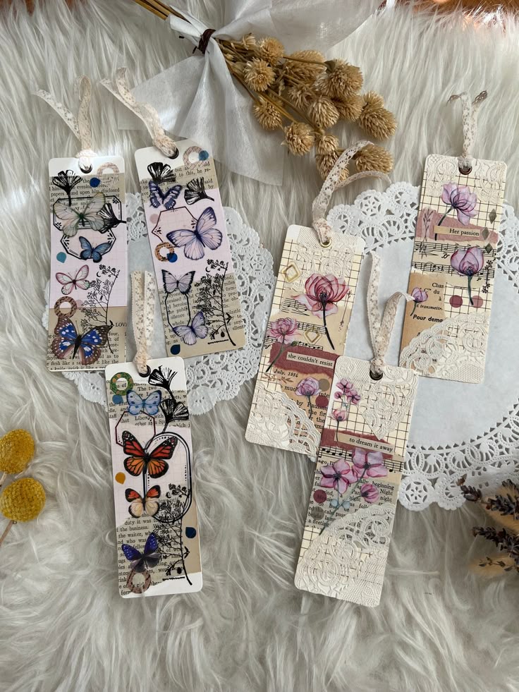 Handmade vintage bookmarks with butterfly and floral designs on a lace doily, perfect for book lovers and gift giving.