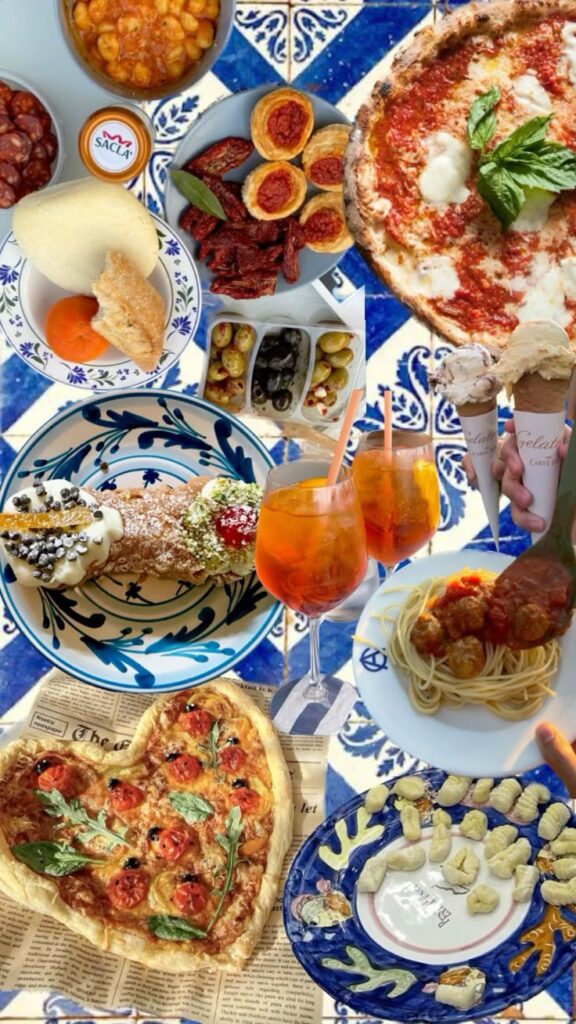 Italian food - Handy Home Assorted Italian cuisine on vibrant blue tiles, featuring pizza, pasta, cannoli, olives, and gelato, with refreshing drinks.