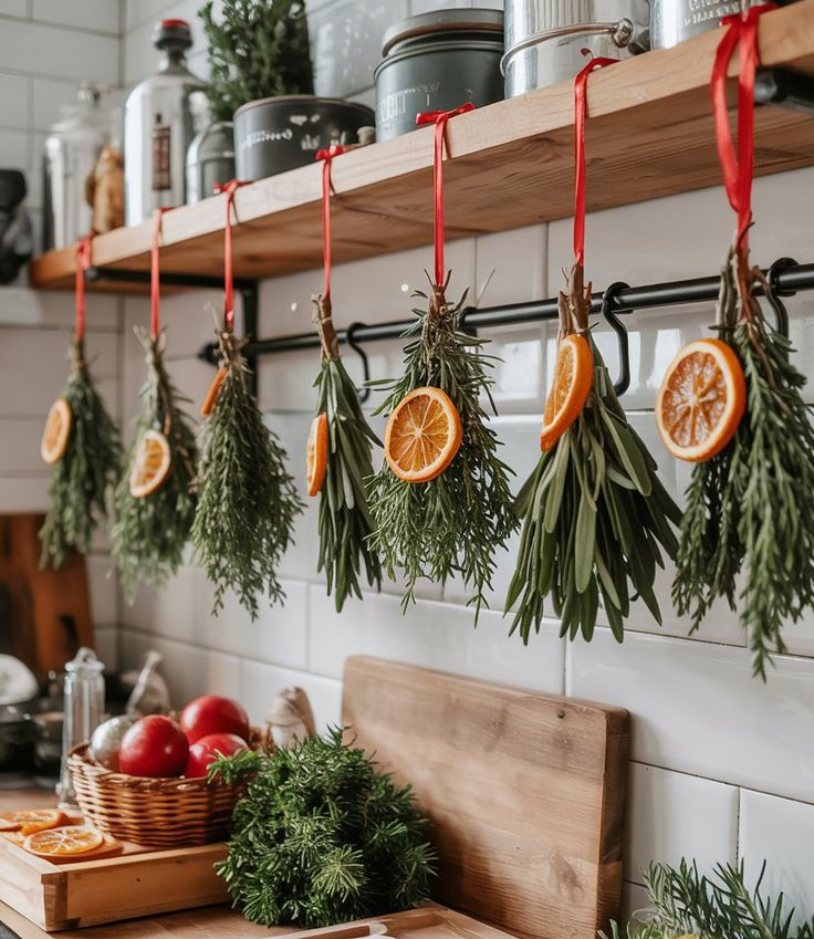 Kitchen Natural Christmas Decor 2025 With Hanging Herbs And Orange Slices - Handy Home Herbs and dried oranges hanging in a rustic kitchen, evoking a cozy and natural culinary atmosphere.