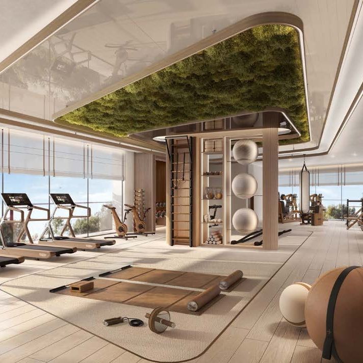 WHAT IS OUR MAIN WEALTH_ Time_ Our loved ones_ - Handy Home Modern gym with eco-friendly design, featuring treadmills, fitness equipment, and a green ceiling for a refreshing workout space.
