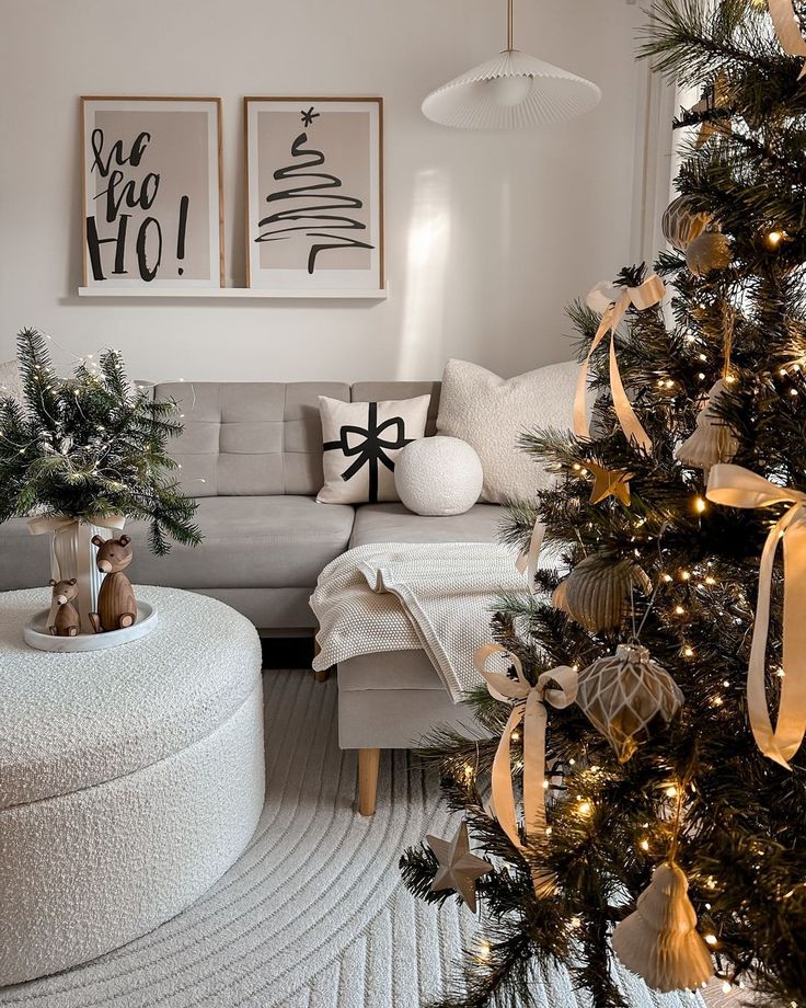 bd86a2c8-48c1-46f3-95d9-6710b4c24dae - Handy Home Cozy living room with Christmas tree, festive decor, and minimalist design featuring neutral tones and holiday accents.