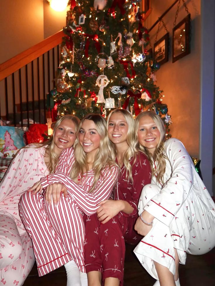 bsfs - Handy Home Four people in festive pajamas smile in front of a decorated Christmas tree, capturing holiday joy and togetherness.