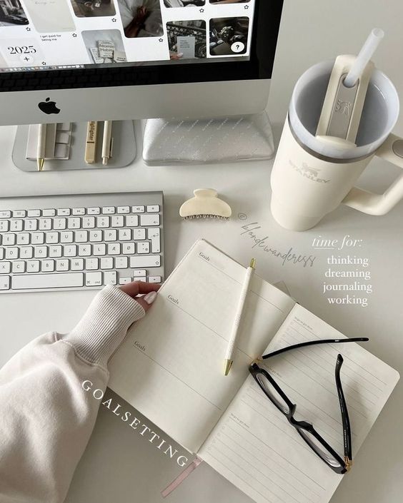 fgnzdghb - Handy Home Minimalist workspace with open planner, keyboard, and coffee. Focus on goal setting and productivity. Cozy and modern aesthetics.