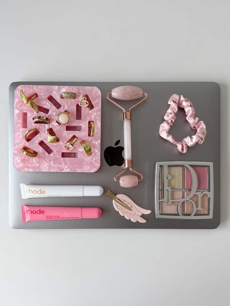 jewelry gold jewelry gold ring ring tray ring - Handy Home Pink beauty essentials on a laptop: jewelry, jade roller, scrunchie, lip balm, makeup palette. Stylish and chic accessories.