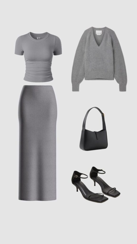 Grey outfit set with a T-shirt, maxi skirt, sweater, black bag, and heels. Perfect monochrome look for chic style enthusiasts.