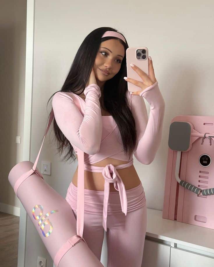 soft life aesthetic - Handy Home Young woman in pink activewear taking a mirror selfie, carrying a matching yoga mat bag.