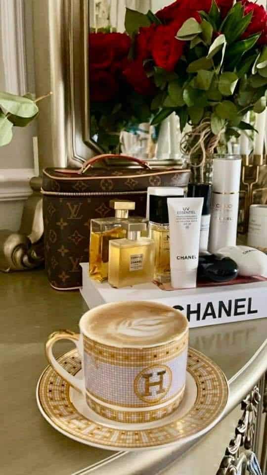 zdfbsrv - Handy Home Luxury vanity setup with Chanel skincare, perfume, elegant coffee cup, and red roses, exuding sophistication and style.