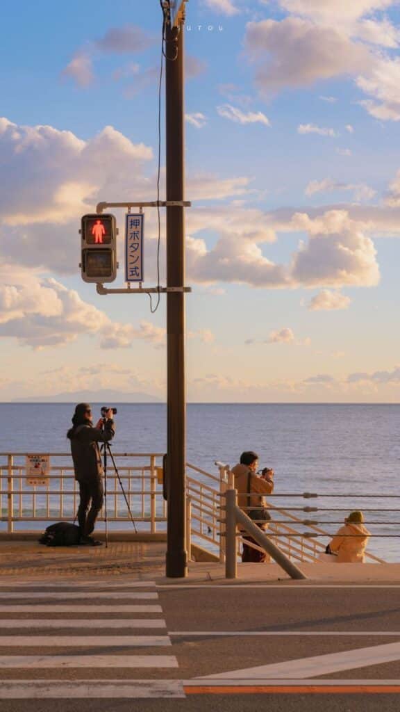 0ba223b0-d054-4aa2-98fc-3752e9bb9b39 - Handy Home Photographers capturing scenic ocean view at sunset near crosswalk, clear sky with clouds in the background.