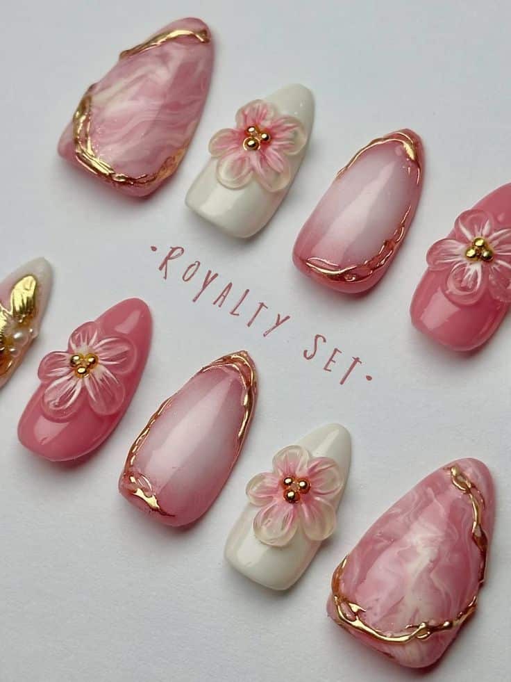 4ba1b935-afdd-4ef6-a51b-7d6deb5225ae - Handy Home Elegant pink and white marble nail art with floral 3D designs and gold accents, titled Royalty Set.