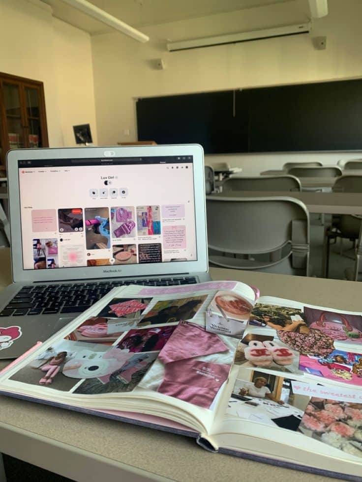 8c6b69ee-aac8-443b-8ee1-c5d9ec63d121 - Handy Home Open laptop showing Pinterest board with a scrapbook on a desk in an empty classroom. Creativity meets digital inspiration.