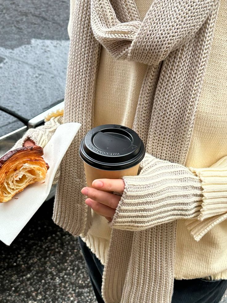 Contrast Scarf Beige _ Djerf Avenue - Handy Home Cozy autumn morning with a knit sweater, scarf, and a hot coffee. Enjoying a pastry while staying warm on a chilly day.