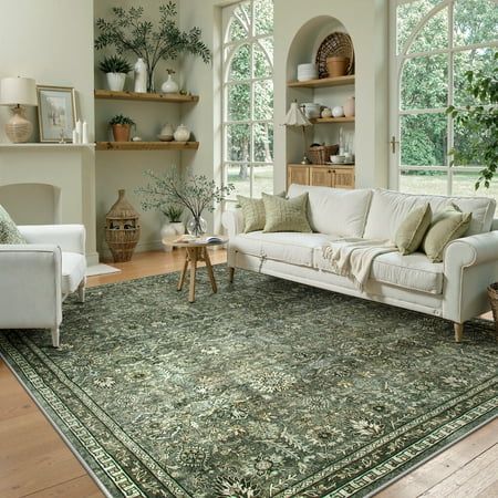 Lahome Sage Green Area Rug 6x9 Machine Washable Rugs for Living Room Boho Olive Green Bedroom Rug Vintage Soft Room Carpet for Dining Room Nursery Apartment Office Size_6 x 9 Elegant living room with green patterned rug, white sofas, potted plants, and large windows, creating a cozy, natural ambiance. - Handy Home Elegant living room with green patterned rug, white sofas, potted plants, and large windows, creating a cozy, natural ambiance.