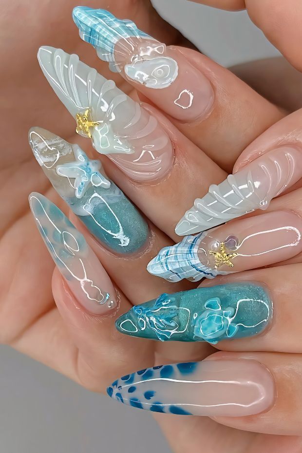Ocean-Inspired Pearl Shell Nail Art - Handy Home Unique ocean-inspired 3D nail art featuring seashells, starfish, and wave designs with blue and white hues.